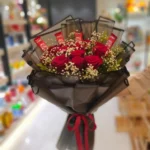 Send 10 Red roses with gipso and kitkat