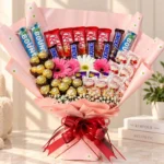 Pink chocolate flower bouquet with Ferrero Rocher, Raffaello, Bounty and colorful daisies