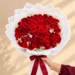 100 red roses with gypsophila white wrapped bouquet