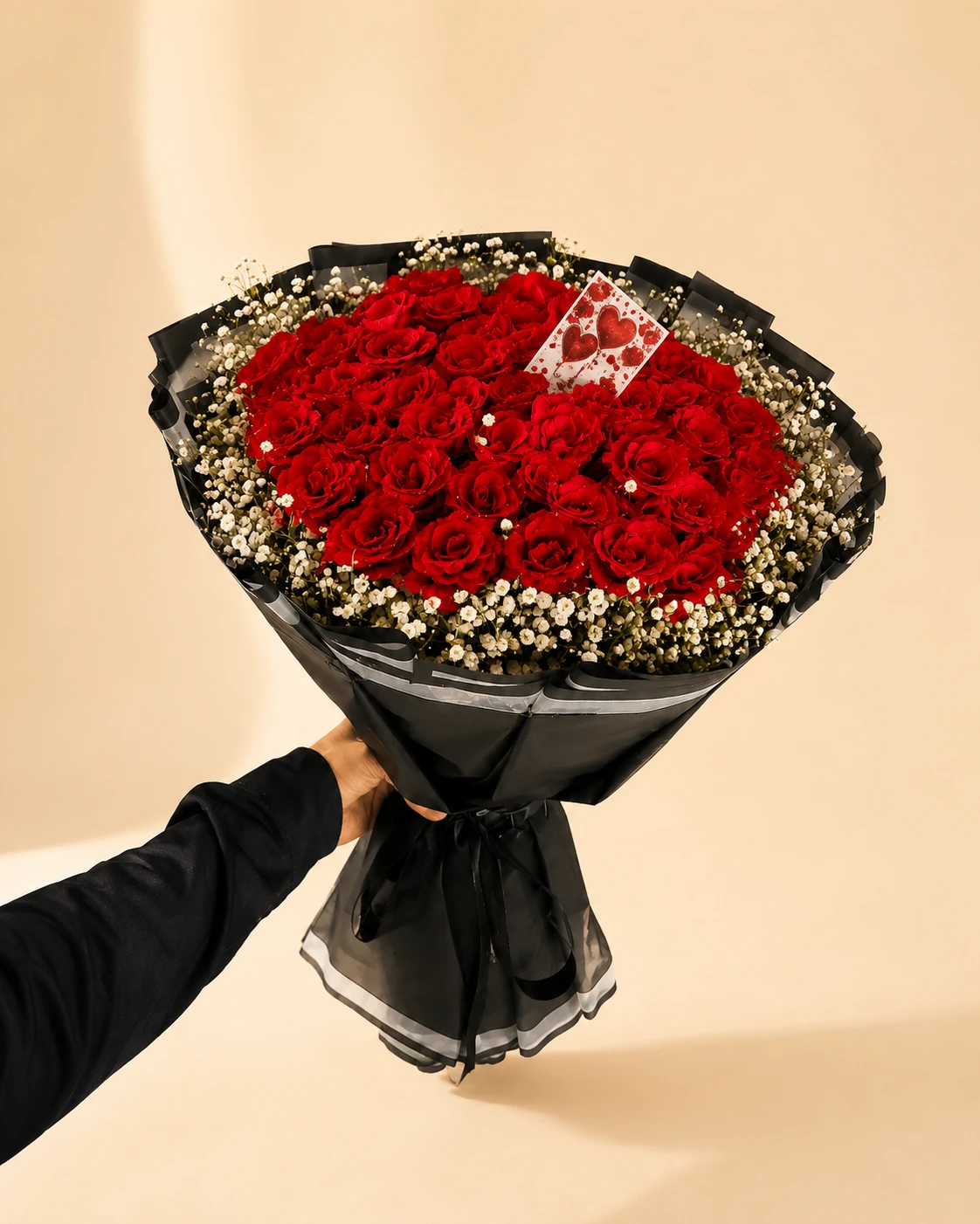 Scarlet Heart Rose Bouquet Heart-shaped red rose bouquet with white filler flowers
