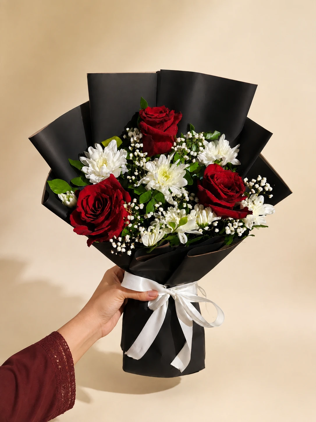 Crimson Daisy Rose Bouquet Red rose and white daisy bouquet with green foliage