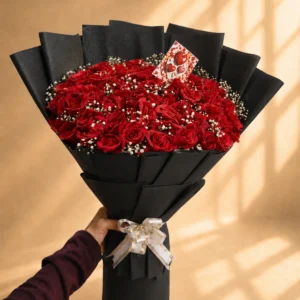 Luxury red rose bouquet with baby's breath in black wrapping